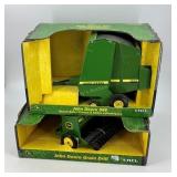 Two John Deere tractor implements