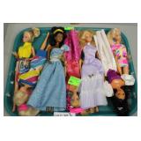 Seven 1990s Barbie figures on tray