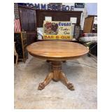 Oak claw foot pedestal dining table