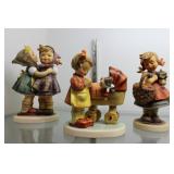 Three Goebel figurines incl girl with basket, girl