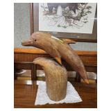 Wood carved dolphin on stand