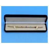 14KT LINK BRACELET 7.5' L WITH 5 RAISED STONES -