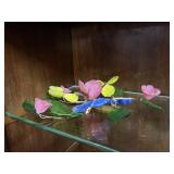 Three handblown glass floral arrangements in paste