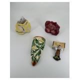 Four porcelain wall pockets: florals and hard-work