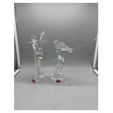 Two Baccarat golf figures