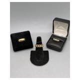 Three 14kt rings - braided, wedding band & diamond