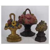 Three early 20th century cast iron floral doorstop