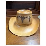 Carved wooden cowboy hat with laser cut steer skul