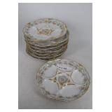 Eight Limoge oyster plates