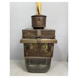 Early Kerosene fueled lamp with brass framing and