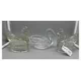 Two crystal hen on nest and single swan