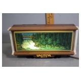 Olympia Beer advertisement lighted with waterfall