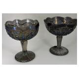 Two Fenton black amethyst carnival pedestal bowls