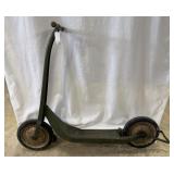 Stamped metal scooter with wooden T-handle, foot b