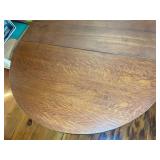 SINGLE PEDESTAL OAK CLAW FOOT DINING TABLE ON WOOD