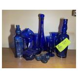 GROUP OF BLUE GLASS VASES AND BOTTLES
