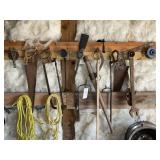 TOOLS ON WALL, LOG TURNER, SAWS, ETC