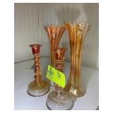 GROUP OF ORANGE CARNIVAL GLASS CANDLE HOLDERS AND