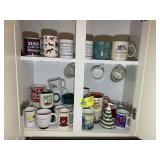 CABINET WITH MISC COFFEE MUGS