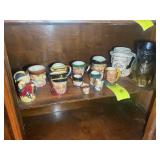 BOTTOM SHELF INSIDE CABINET, MISC GROUP OF FACED M