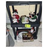 BOTTOM TWO SHELVES OF CHRISTMAS THEMED ITEMS