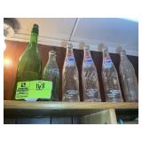 TOP SHELF IN CLOSET CONTAINING PEPSI AND COKE BOTT