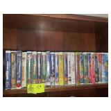 TWO SHELVES OF VHS MOVIES, DUMBO, BAMBI, FINDING N