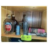 TWO SHELVES OF VINTAGE ITEMS, LOCK BOX, OIL CAN, S