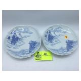 Pair of white and blue story plates