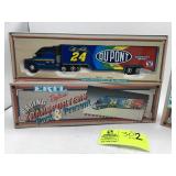 PAIR OF ERTL REPLICAS RACING TRANSPORTERS PAST AND