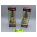 PAIR OF COCA COLA GOLD COLORED COMMEMORATIVE BOTTL