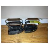 PAIR OF CAST IRON IRONS