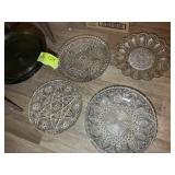 A GROUP OF GLASS SERVING PLATTERS AND CAKE STAND