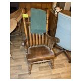 A VINTAGE WOODEN ROCKING CHAIR