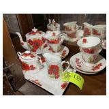 BOTTOM LEFT SHELF OF CHINA HUTCH; POPPY THEMED TEA