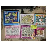 A GROUP OF SIX MINIATURE TEA SETS APPEAR TO BE NIB