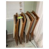 A GROUP OF STACKMORE WOOD FRAMED FOLDING CHAIRS