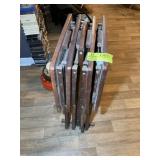 A GROUP OF WOODEN STANDS AND TV TRAYS