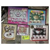 A GROUP OF FIVE MINIATURE TEA SETS APPEAR NIB