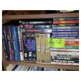SHELF WITH MISC. BOOKS AND VHS CASSETTES; STAR WAR