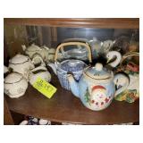 TOP SHELF OF CURIO CABINET, INCLUDING TEA POTS, CR