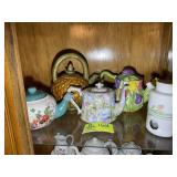 GROUP OF DECORATIVE TEAPOTS; FLORAL THEMED