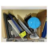 TOP SHELF OF PANTRY INCLUDING CUTTING BOARDS WATER