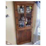 FOUR-DOOR CORNER CABINET APPROXIMATELY 24 IN BY 34