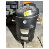 ELECTRIC SMOKER WITH BAG OF WOOD CHIPS SHOWS MINIM