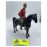 GROUP OF VINTAGE TOYS INCLUDING CANADIAN MOUNTY AN