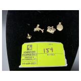 GROUP OF WHAT APPEAR TO BE 14K GOLD CHARMS TO INCL