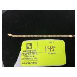 APPEARS TO BE MARKED 14K YELLOW GOLD TRIPLE ROW RO