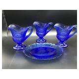 GROUP INCLUDING THREE COBALT BLUE COLOR CREAMERS A