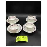 GROUP OF FOUR TEACUPS AND SAUCERS WHITE PURPLE FLO